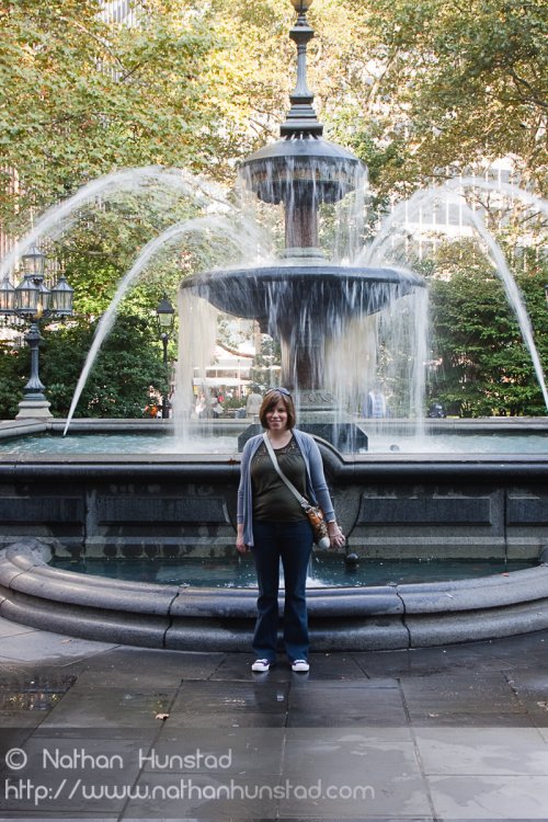 Julia Miller standing in front of the fountain in City Hall Park